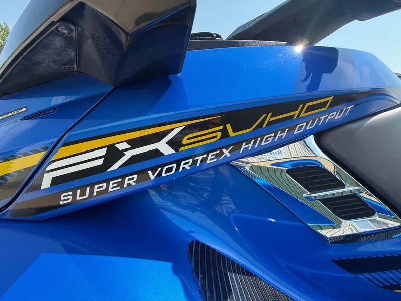 Slide: The Image of Close-up of a blue 2016 Yamaha WaveRunner FX Cruiser SVHO with bold graphics. - 4