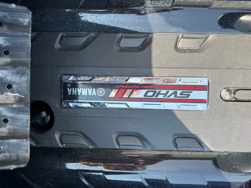 Slide: The Image of Close-up of the Yamaha WaveRunner FX Cruiser SVHO logo on a textured surface. - 10
