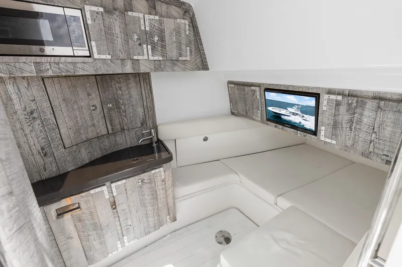 Slide: The Image of 2020 HCB 53 Suenos cabin interior with rustic wood finish and modern amenities. - 59