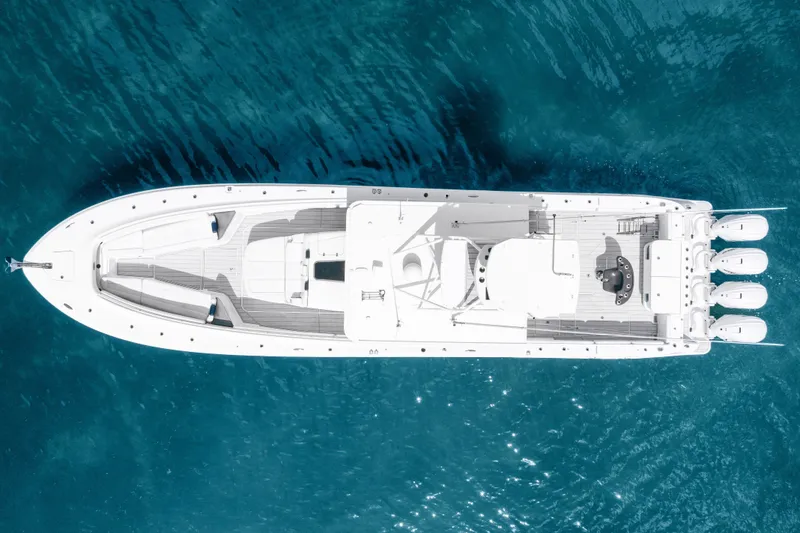 Slide: The Image of Aerial view of 2020 HCB 53 Suenos boat on clear blue water. - 25
