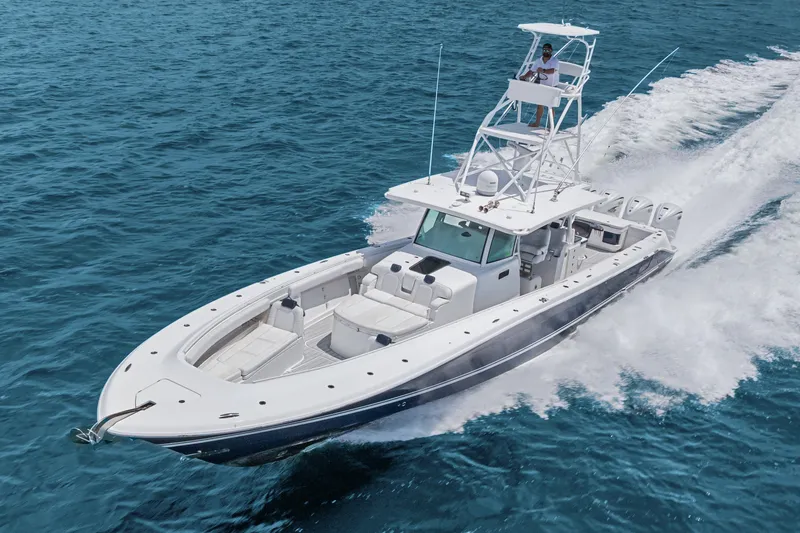 Slide: The Image of 2020 HCB 53 Suenos boat cruising on clear blue ocean waters. - 23