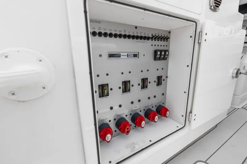 Slide: The Image of Electrical panel inside 2020 HCB 53 Suenos boat, featuring switches and controls. - 77