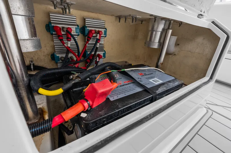 Slide: The Image of Battery compartment of 2020 HCB 53 Suenos boat with wiring and components. - 74