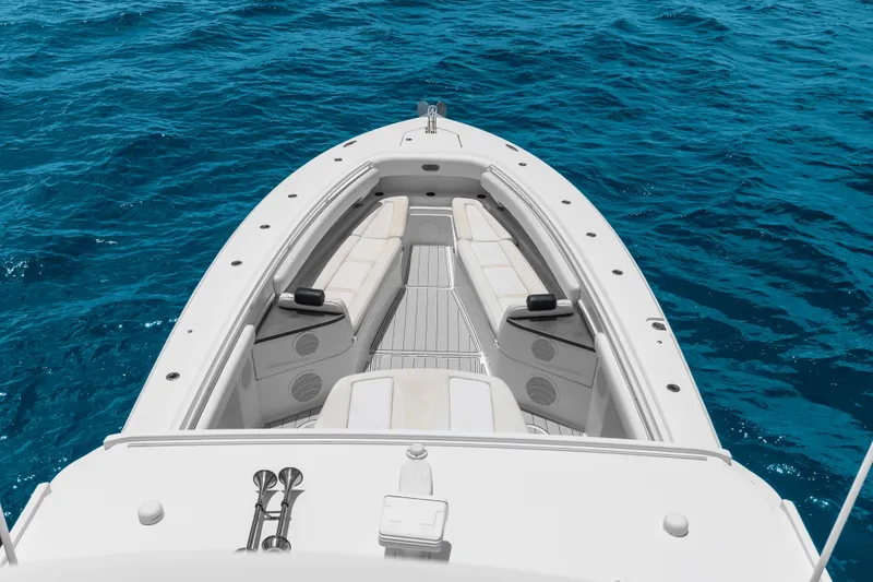 Slide: The Image of 2020 HCB 53 Suenos boat deck with luxurious seating on blue ocean water. - 69