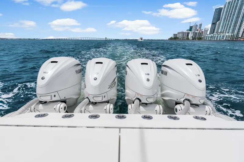 Slide: The Image of 2020 HCB 53 Suenos boat with four Yamaha V8 outboard engines cruising on blue water. - 67