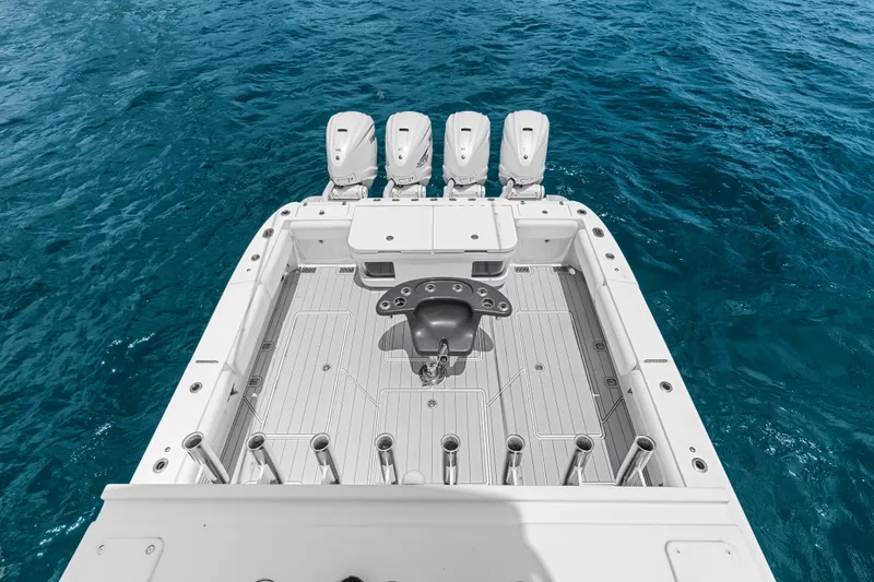 Slide: The Image of 2020 HCB 53 Suenos boat deck with quad engines on open water. - 71