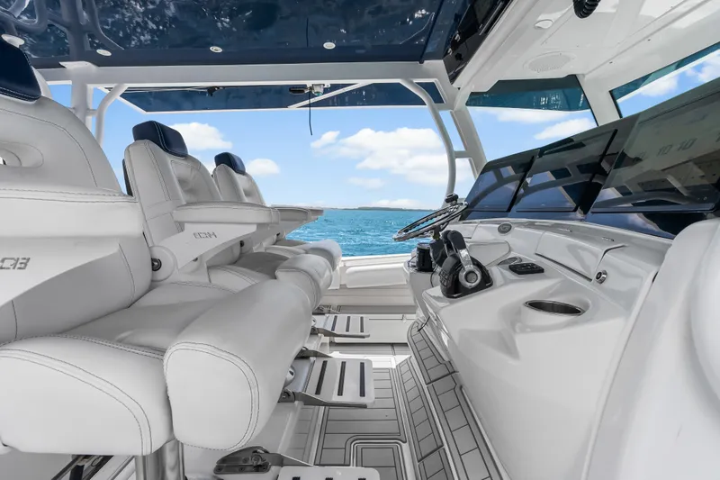 Slide: The Image of Interior view of 2020 HCB 53 Suenos boat with luxurious seating and modern controls. - 43