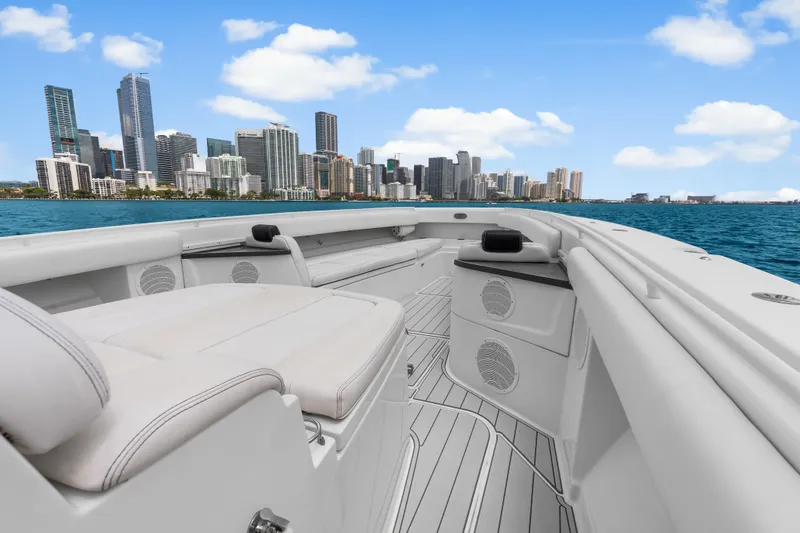 Slide: The Image of 2020 HCB 53 Suenos boat with city skyline in the background. - 31
