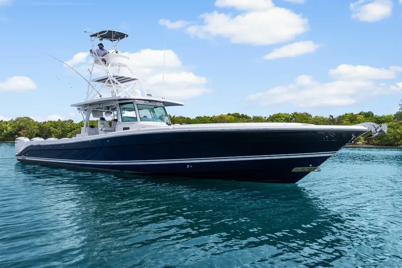 Slide: The Image of 2020 HCB 53 Suenos boat on clear blue water under a sunny sky. - 7