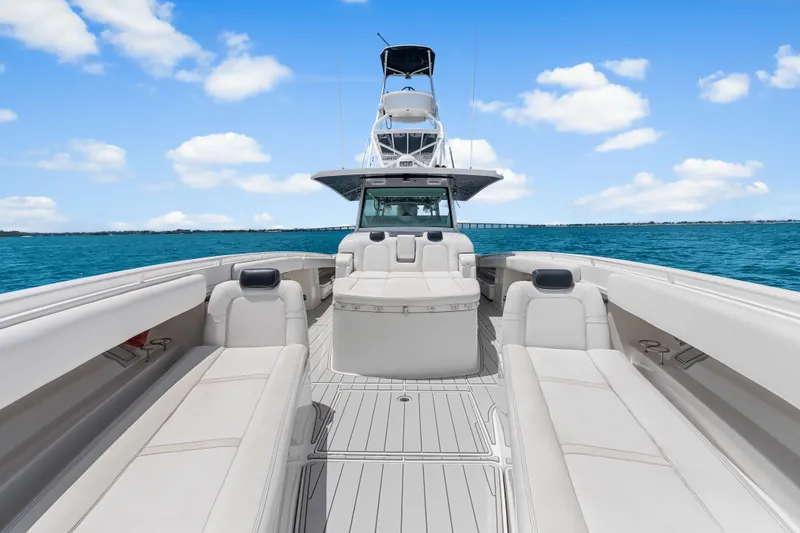 Slide: The Image of 2020 HCB 53 Suenos luxury boat interior with white seating on open water. - 28