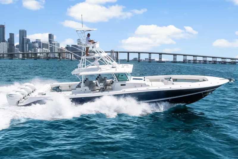Slide: The Image of 2020 HCB 53 Suenos boat cruising near city skyline and bridge. - 14