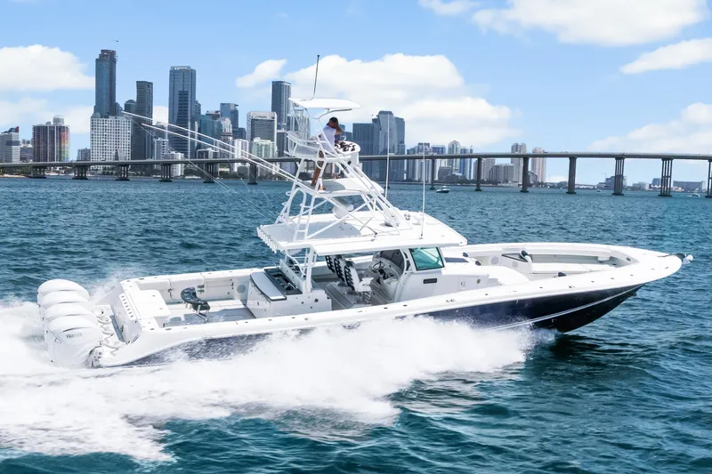 Slide: The Image of 2020 HCB 53 Suenos boat cruising near city skyline and bridge. - 13