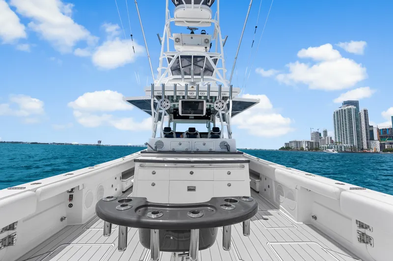 Slide: The Image of 2020 HCB 53 Suenos boat on water with city skyline in background. - 54