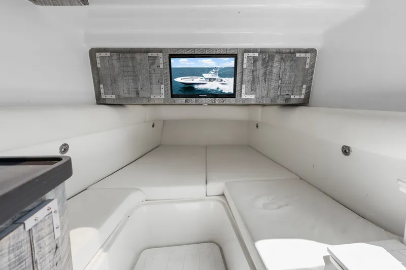 Slide: The Image of Interior cabin of 2020 HCB 53 Suenos boat with modern seating and wall-mounted screen. - 60