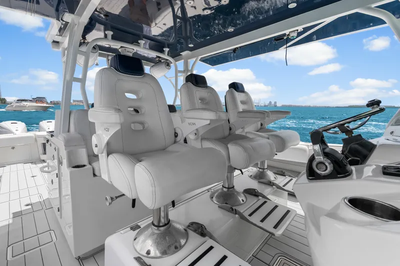 Slide: The Image of Luxury seating on 2020 HCB 53 Suenos boat, ocean view in background. - 42