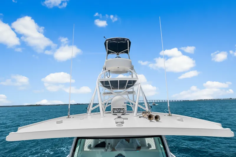 Slide: The Image of 2020 HCB 53 Suenos boat on open water under clear blue sky. - 35