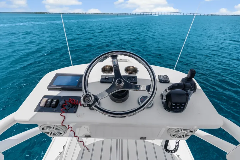 Slide: The Image of Helm of 2020 HCB 53 Suenos boat with ocean view and bridge in background. - 68