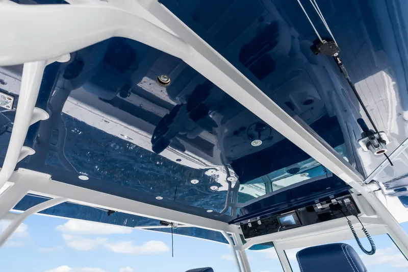 Slide: The Image of 2020 HCB 53 Suenos boat interior with sleek blue ceiling and modern equipment. - 44