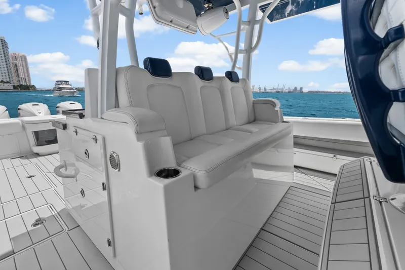 Slide: The Image of 2020 HCB 53 Suenos luxury boat interior with white seating and ocean view. - 41