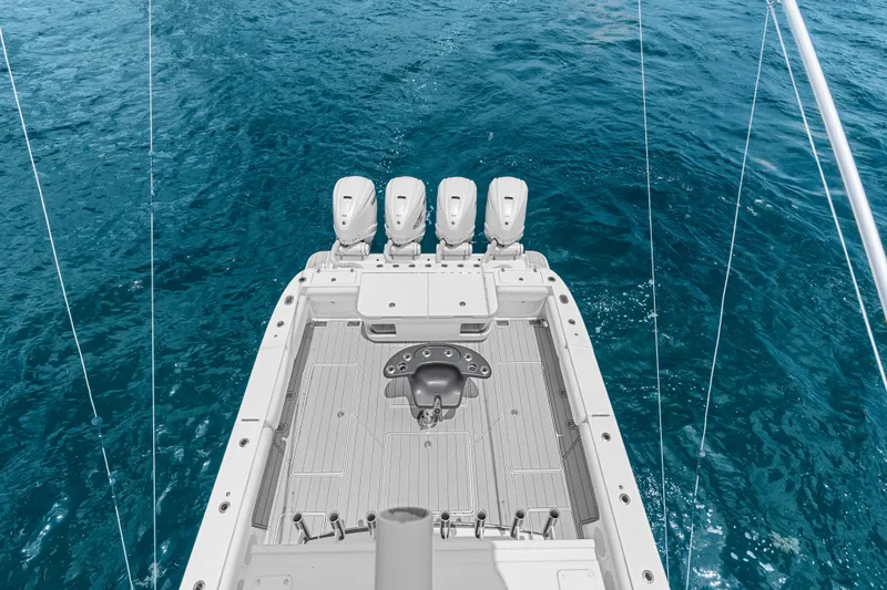 Slide: The Image of 2020 HCB 53 Suenos boat with four engines on open water. - 70