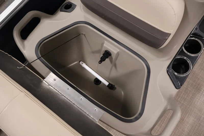 Slide: The Image of 2024 Sun Tracker Bass Buggy 16 XL boat storage compartment with cup holders and seating. - 17