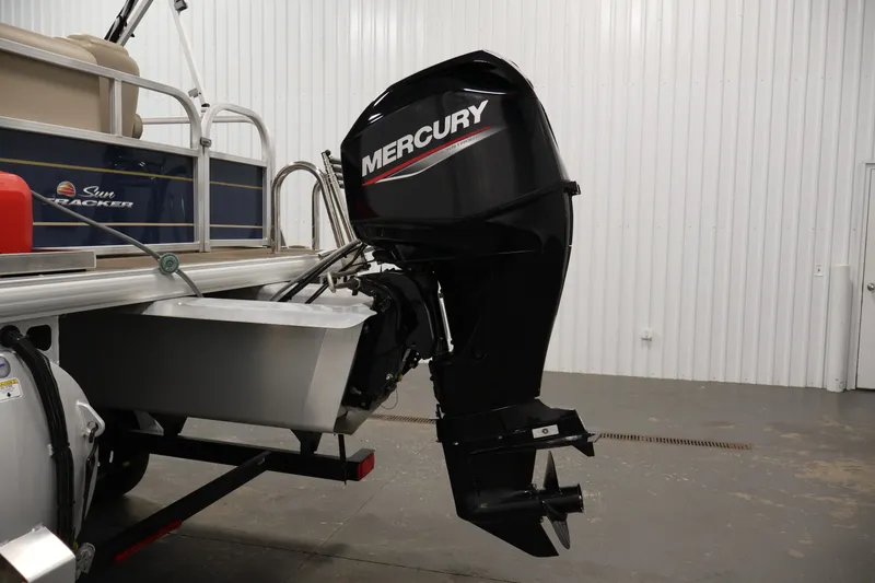 Slide: The Image of 2024 Sun Tracker Bass Buggy 16 XL with Mercury outboard motor in a showroom. - 32