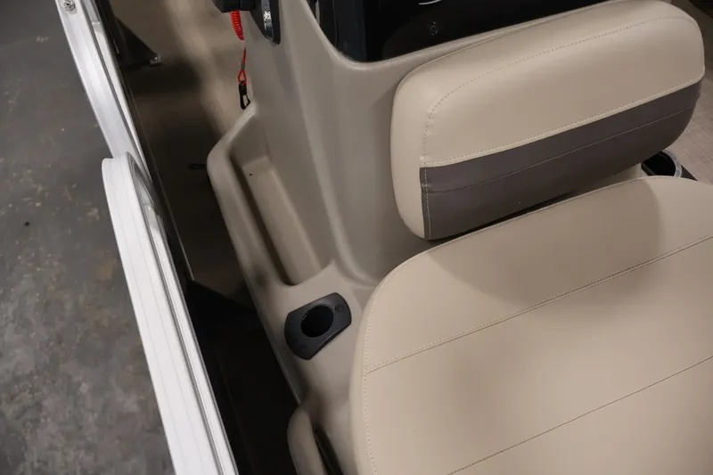 Slide: The Image of 2024 Sun Tracker Bass Buggy 16 XL boat seat with beige upholstery and cup holder. - 18