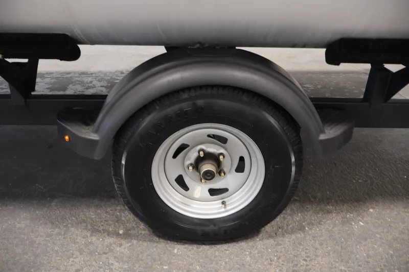 Slide: The Image of 2024 Sun Tracker Bass Buggy 16 XL trailer wheel and fender detail. - 37