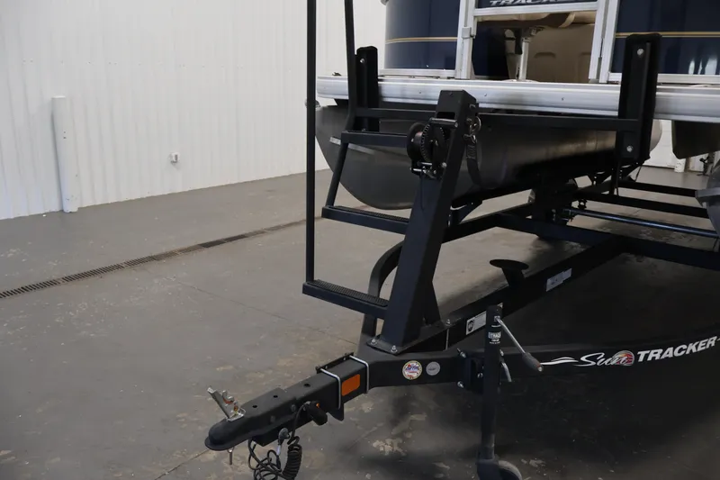 Slide: The Image of 2024 Sun Tracker Bass Buggy 16 XL on trailer in indoor setting. - 35