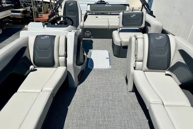 Slide: The Image of 2026 Barletta Cabrio 24U pontoon boat interior with luxurious seating and modern design. - 10