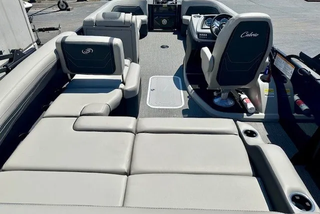 Slide: The Image of 2026 Barletta Cabrio 24U pontoon boat interior with plush seating and modern dashboard. - 15