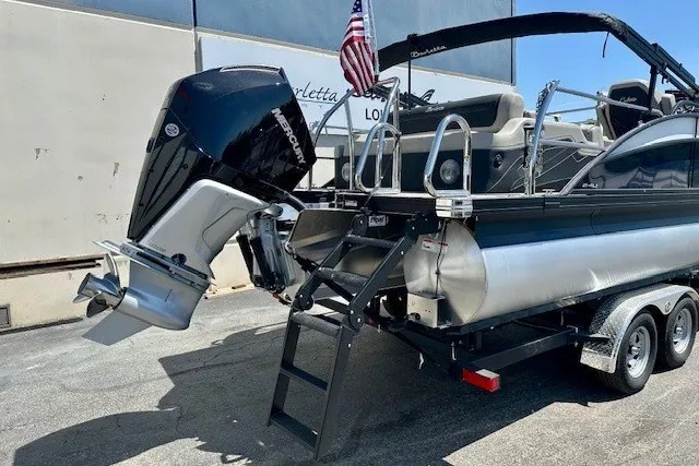 Slide: The Image of 2026 Barletta Cabrio 24U pontoon boat on trailer with powerful outboard motor. - 5