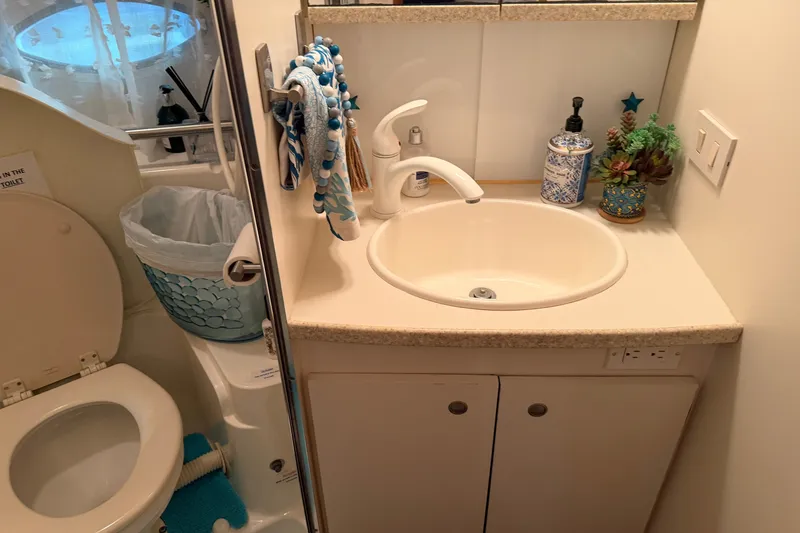 Slide: The Image of Bathroom interior of 1998 Silverton 352 Motor Yacht with sink and toilet. - 18
