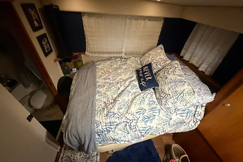 Slide: The Image of Cozy bedroom in 1998 Silverton 352 Motor Yacht with nautical-themed bedding. - 20