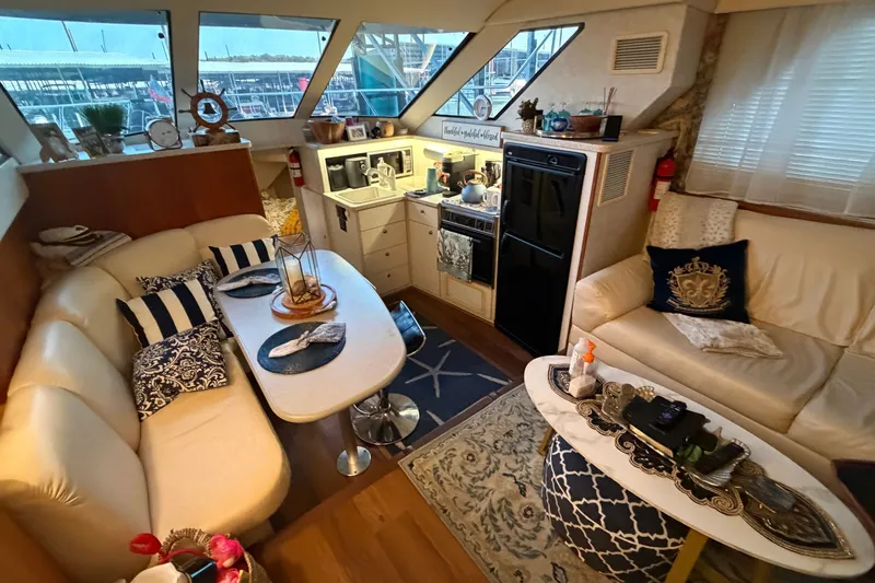 Slide: The Image of Luxurious interior of a 1998 Silverton 352 Motor Yacht with elegant seating and decor. - 26