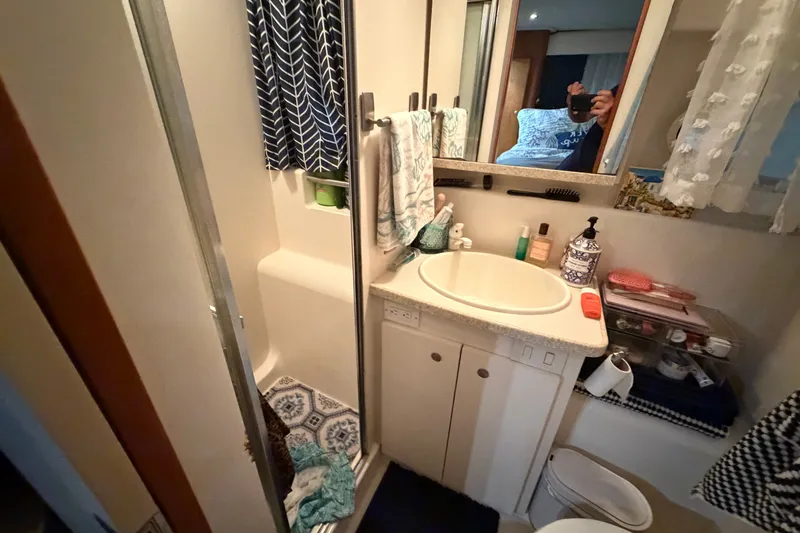 Slide: The Image of Bathroom interior of 1998 Silverton 352 Motor Yacht with shower and vanity. - 22