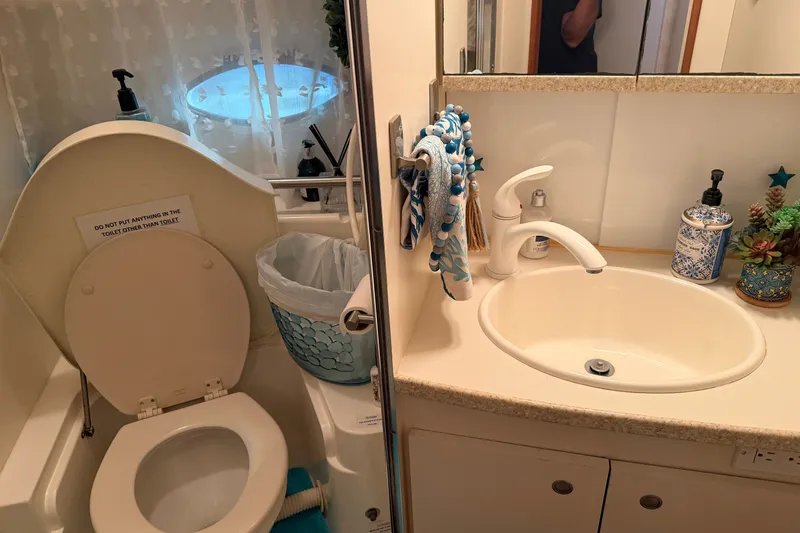 Slide: The Image of Bathroom interior of 1998 Silverton 352 Motor Yacht with toilet and sink. - 17