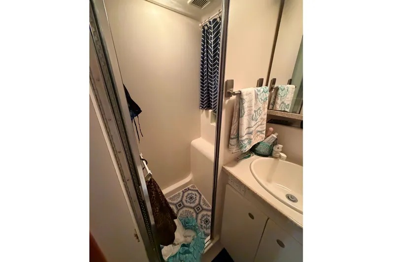 Slide: The Image of Bathroom interior of 1998 Silverton 352 Motor Yacht with shower and sink. - 23