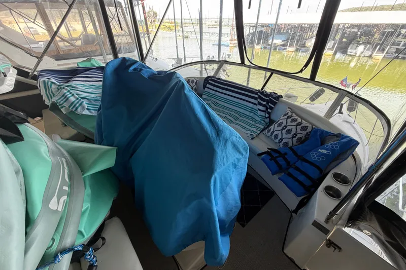 Slide: The Image of 1998 Silverton 352 Motor Yacht interior with colorful cushions and life jackets. - 9