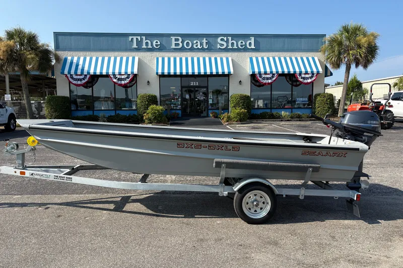 The Image of 2027 SeaArk DXS 1548 DKLD boat on trailer outside The Boat Shed. - 2