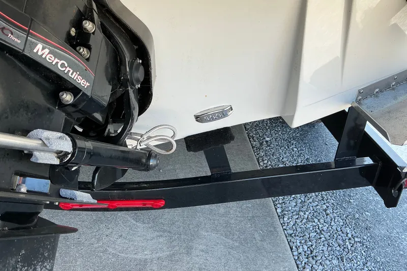 Slide: The Image of 2022 Crownline 290 SS boat with MerCruiser engine on a trailer. - 11