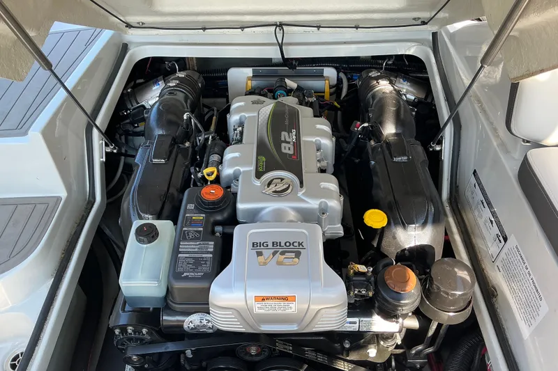 Slide: The Image of Engine compartment of 2022 Crownline 290 SS boat, featuring a powerful V8 engine. - 16