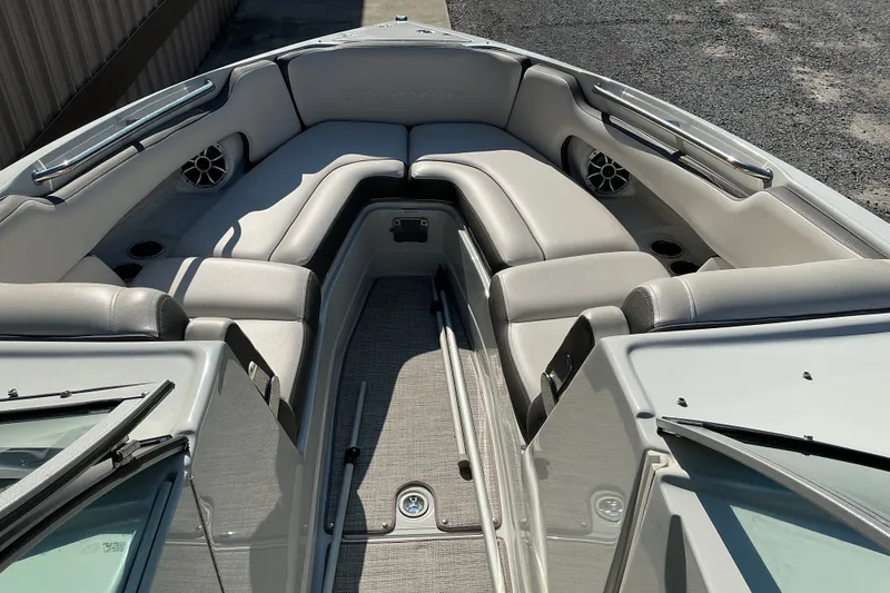 Slide: The Image of 2022 Crownline 290 SS boat interior with plush seating and modern design. - 22