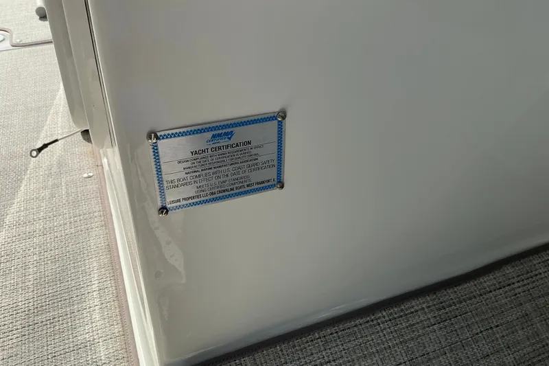 Slide: The Image of Yacht certification plaque on 2022 Crownline 290 SS boat interior. - 20