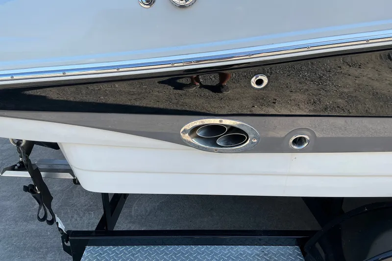 Slide: The Image of 2022 Crownline 290 SS boat exhaust detail on trailer. - 9