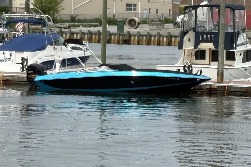 Slide: The Image of 2021 Checkmate Pulsare 2400 BRX boat docked in a marina. - 30