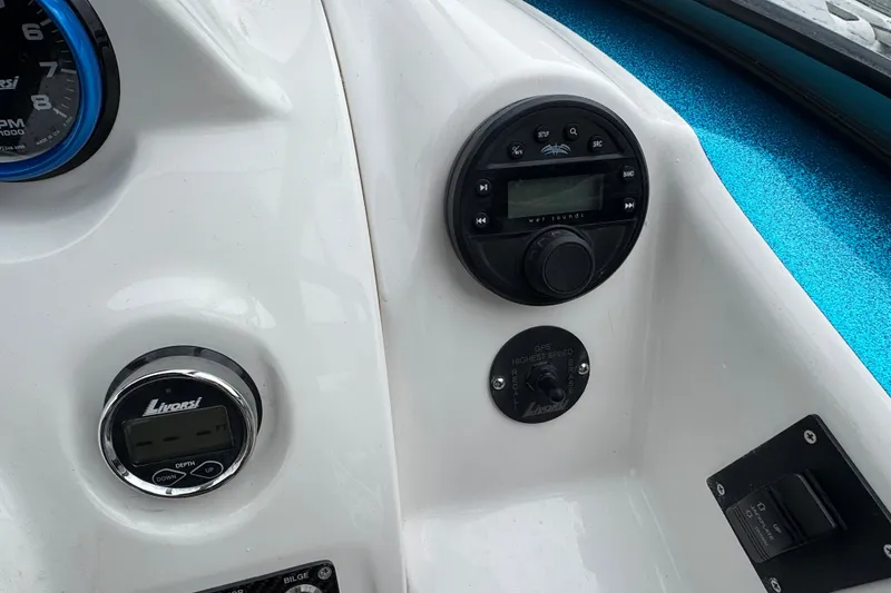 Slide: The Image of Dashboard of 2021 Checkmate Pulsare 2400 BRX boat with Livorsi gauges and controls. - 14