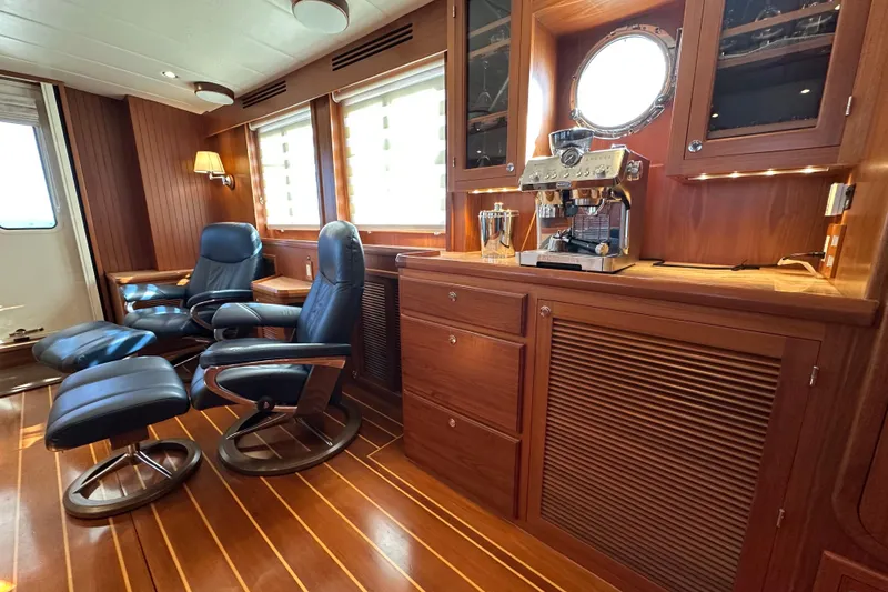 Slide: The Image of Luxurious interior of 2017 Kadey-Krogen 58EB yacht with leather chairs and espresso machine. - 15