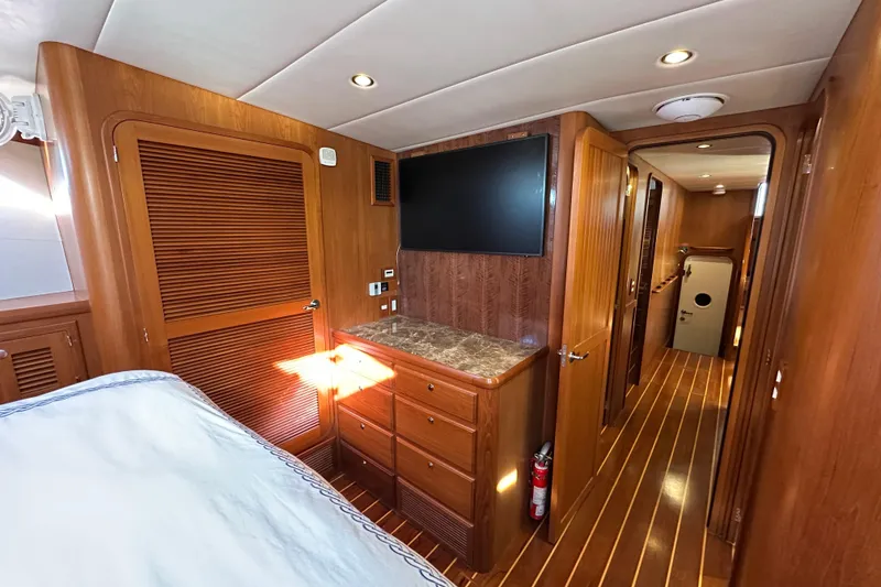 Slide: The Image of Luxurious 2017 Kadey-Krogen 58EB yacht interior with wood paneling and modern amenities. - 38