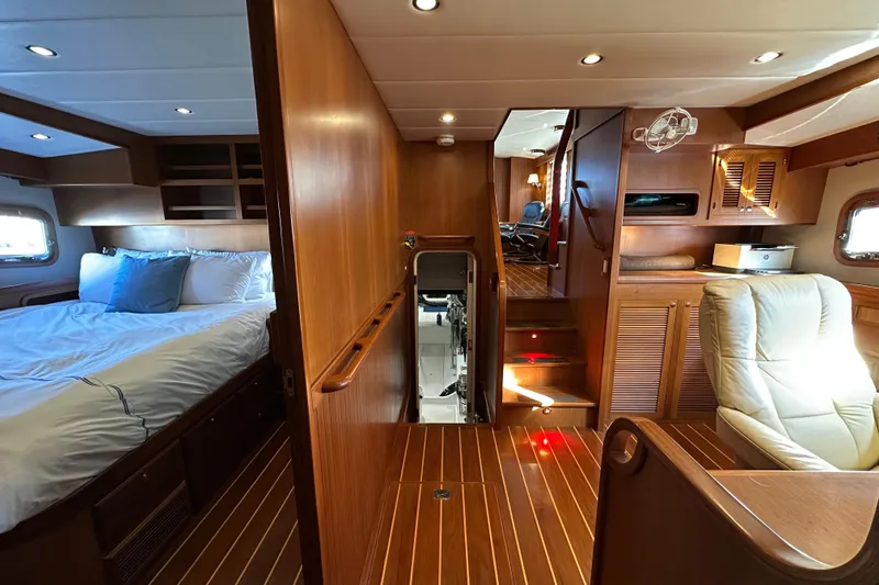 Slide: The Image of Luxurious interior of 2017 Kadey-Krogen 58EB yacht with wood paneling and comfortable seating. - 43